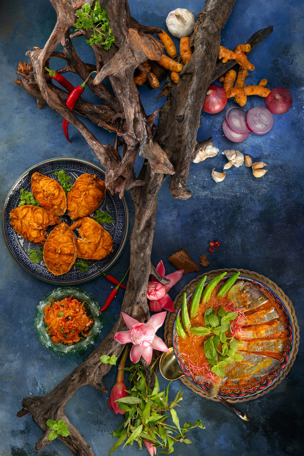 A dramatic overhead spread of signature Nyonya dishes