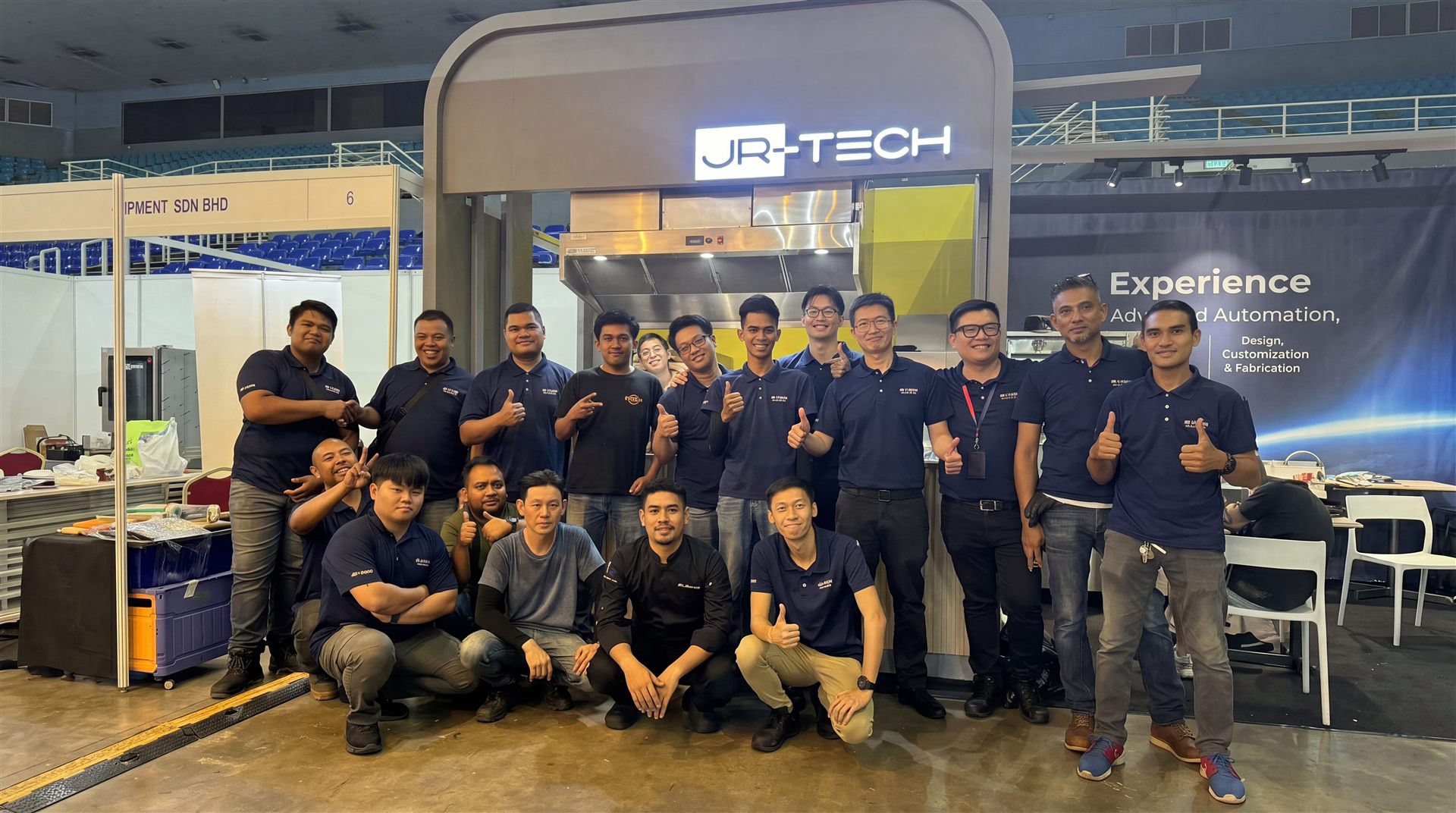 JR-Tech team in front of a commercial kitchen